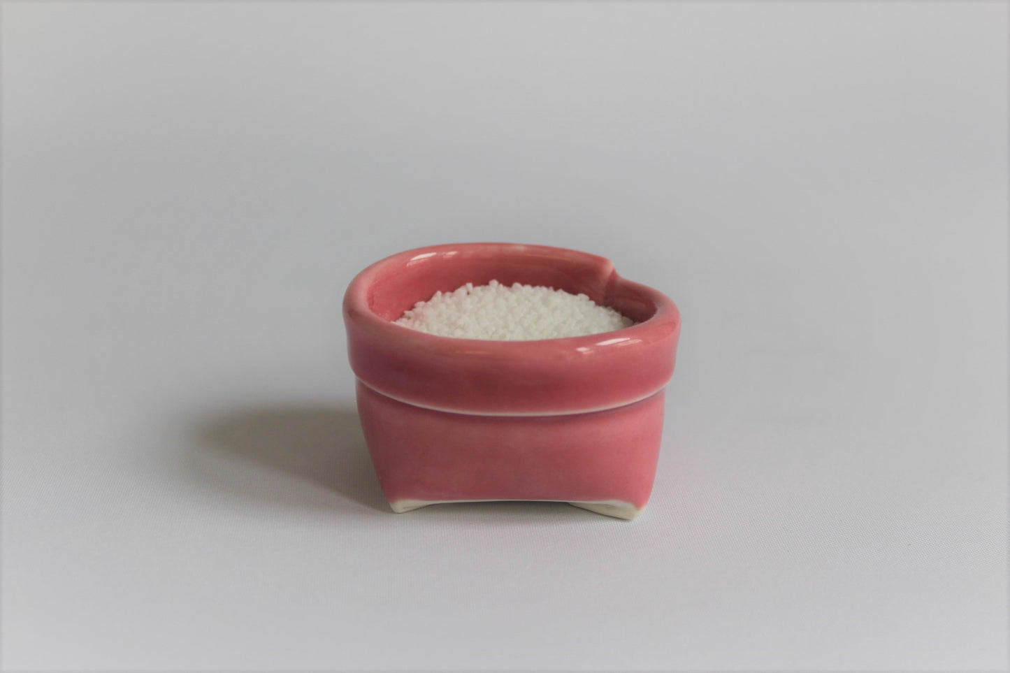 1. Lyserød porcelænspose