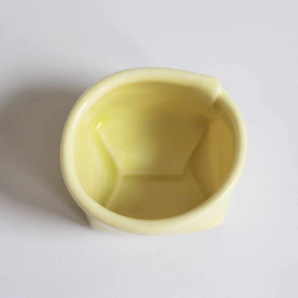 1. Gul porcelænspose