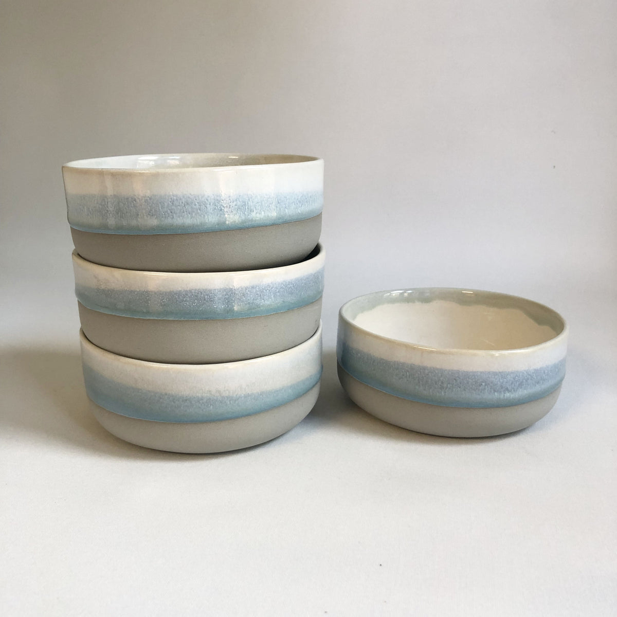 Small bowl with matte grey bottom and ice-blue glaze
