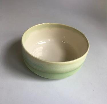 Small bowl with matte green base and green glaze