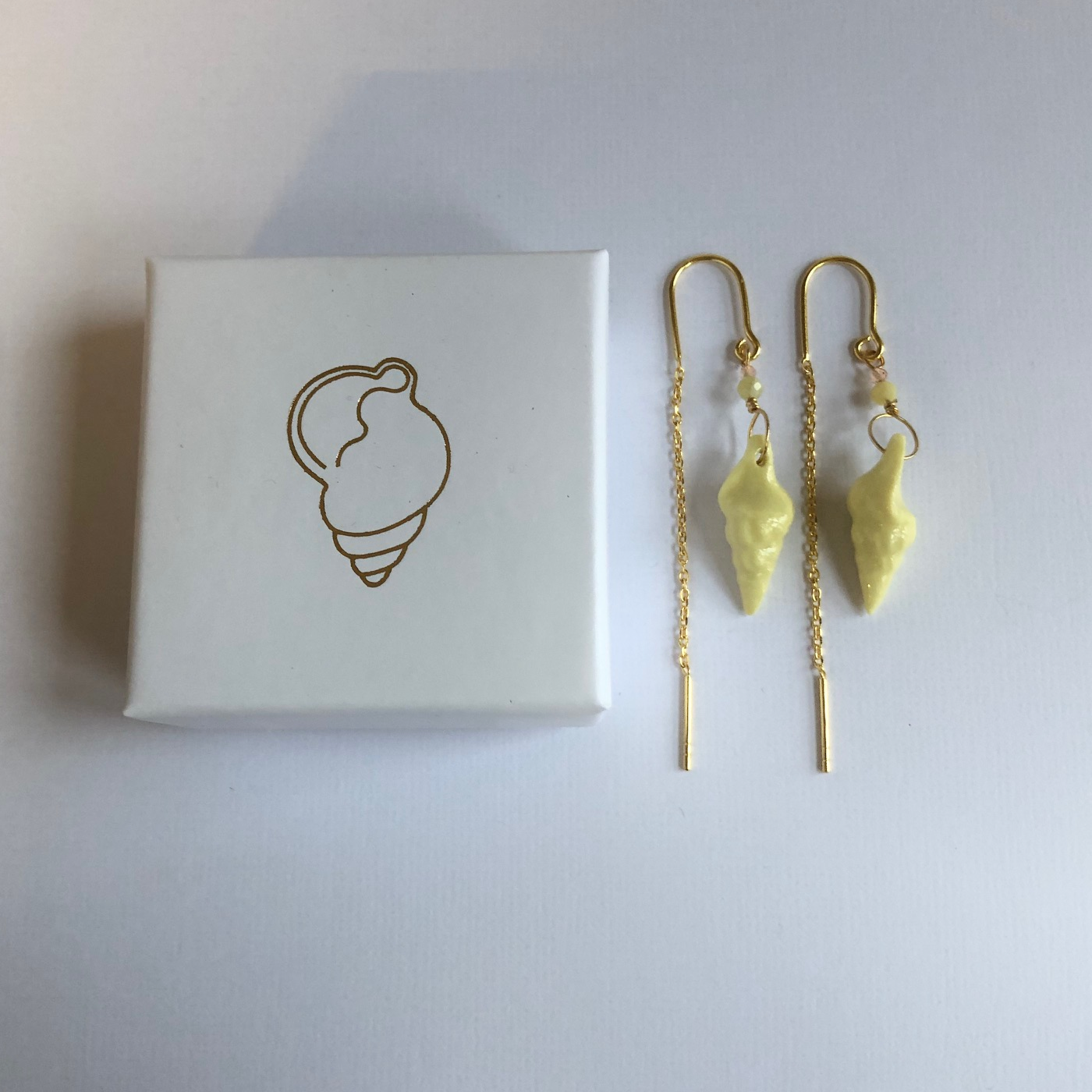 Earrings with handmade porcelain conch shells and stone beads
