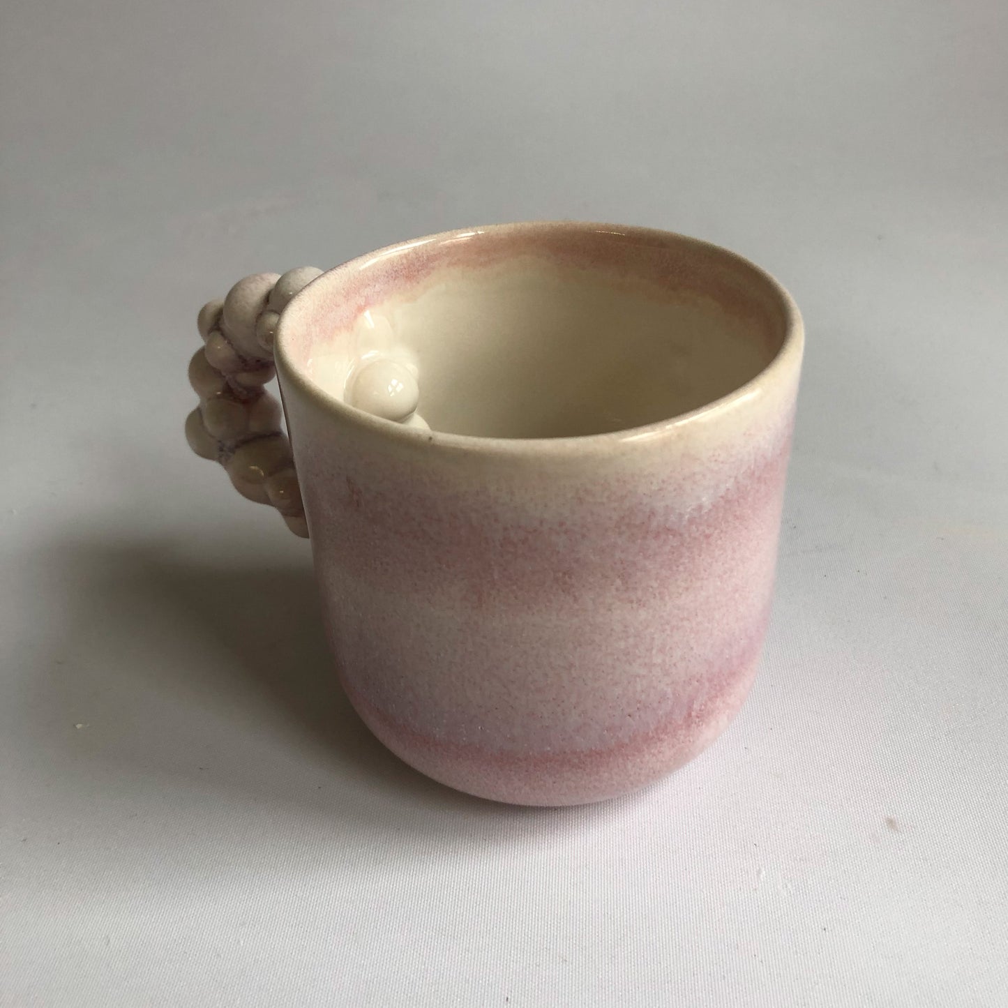 Little cup with rosa glaze
