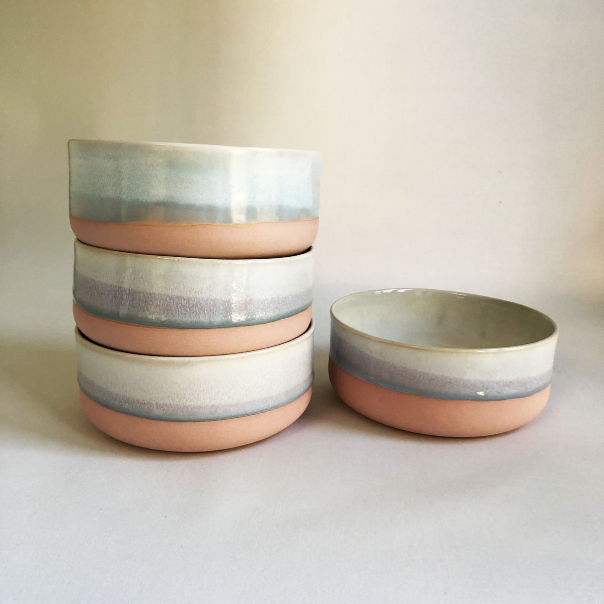 Large bowl with a matte pink bottom and ice blue glaze