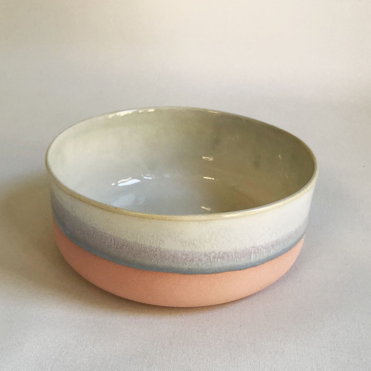 Large bowl with a matte pink bottom and ice blue glaze