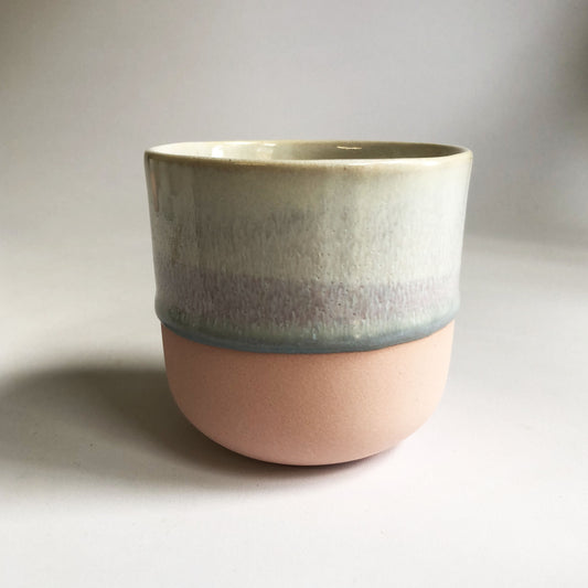 Big cup without a handle with a matte pink base and ice-blue glaze