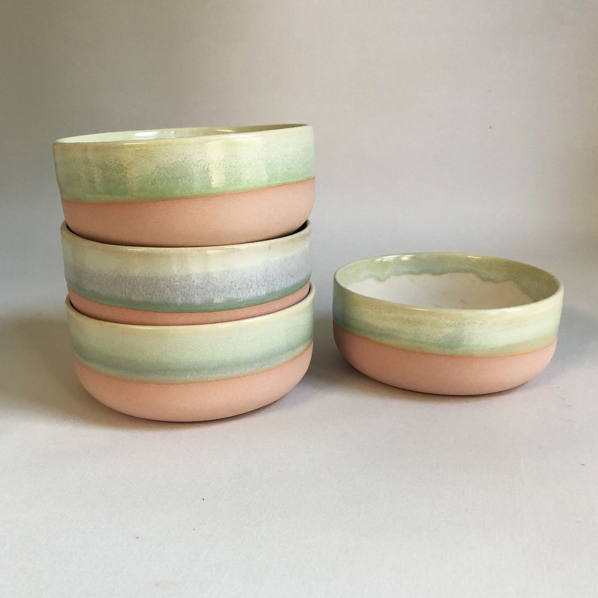 Small bowl with a matte pink bottom and green glaze