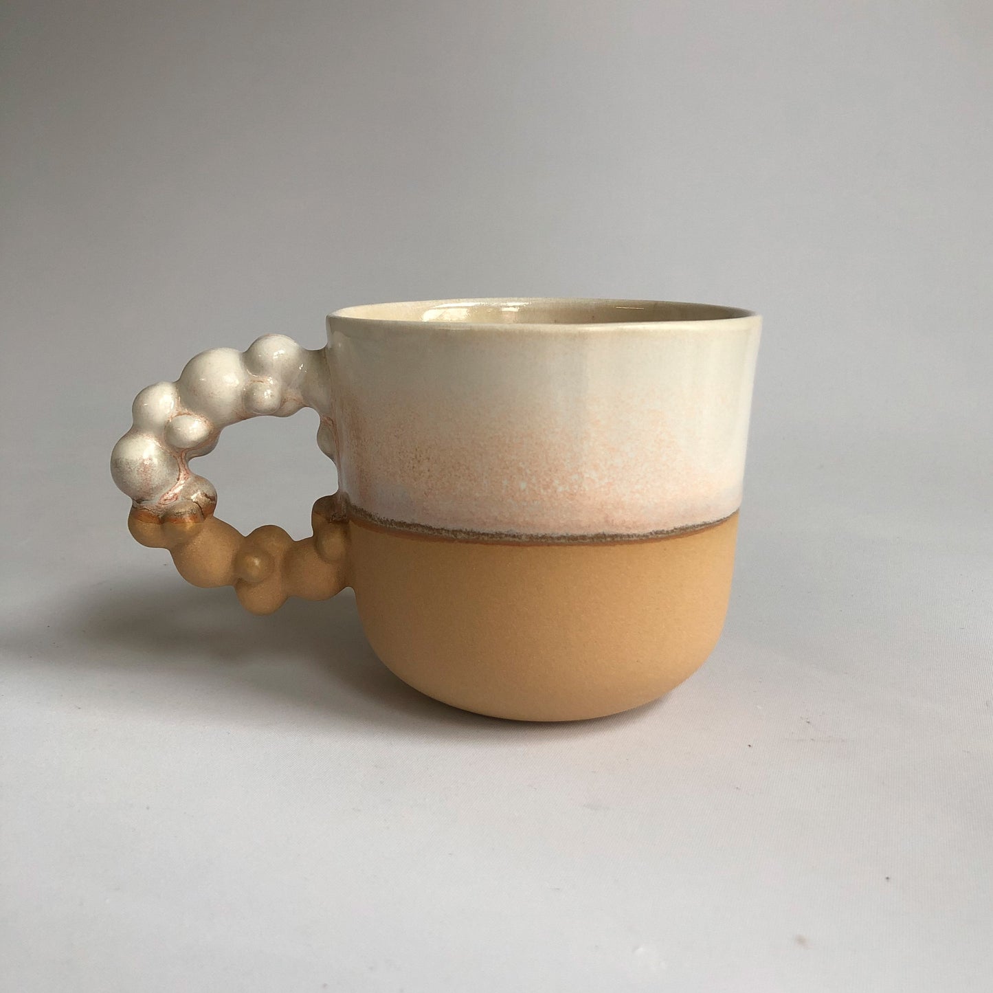 Big cup with matte light brown and white glaze